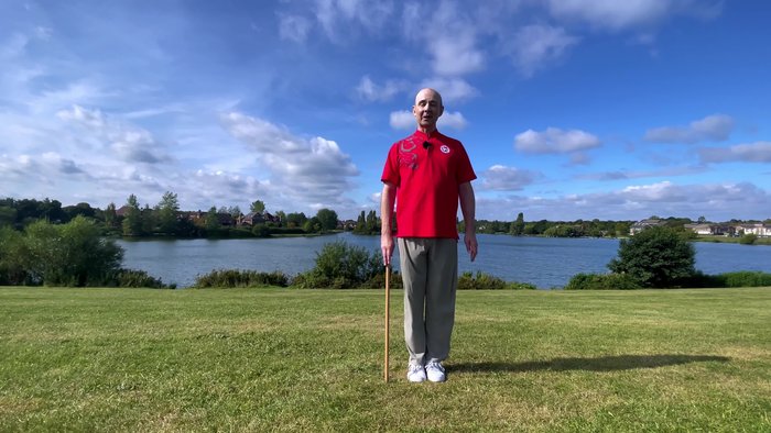 Jing L draw stick to hand, soften the knees, step gently open to the left and we begin