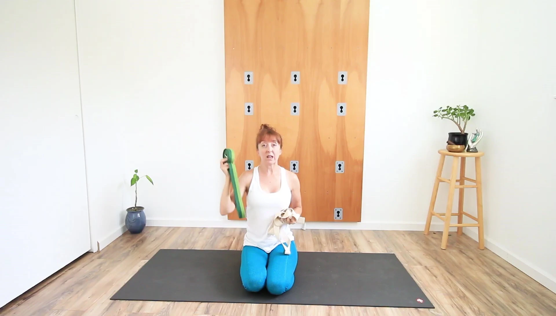 Using a strap to deepen a stretch