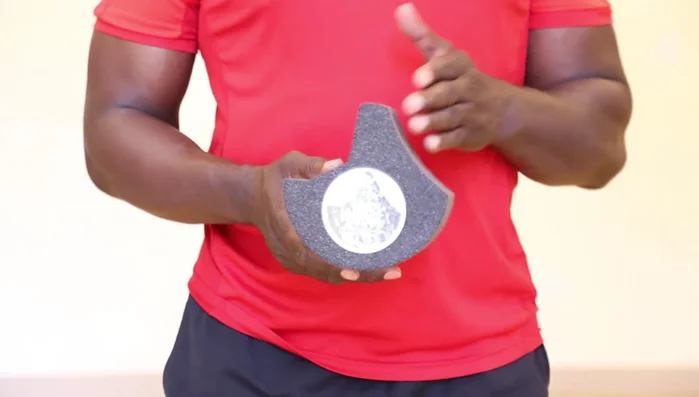 Brace yourself on your forearms and knees. Relax your body, and breathe deeply to release tension.