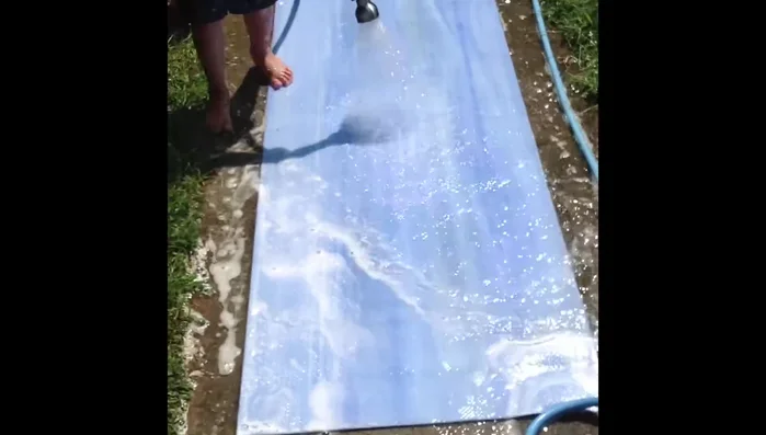 Rinse the mat thoroughly with fresh water to remove all soap residue.