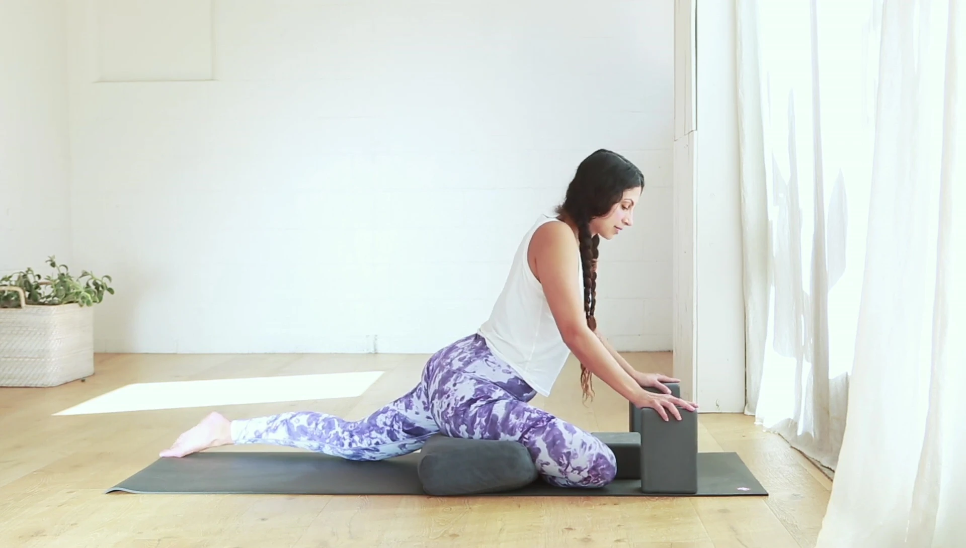Pressing down on the blocks to lift the hips