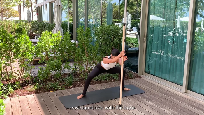 Move the stick from side to side as you bend over.