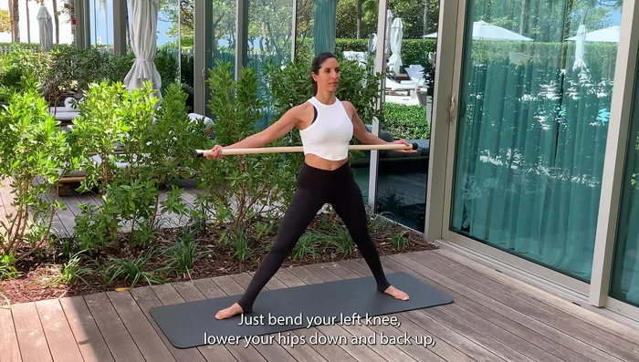 Lower your hips and bend/straighten your knee, keeping your chest open and upright.