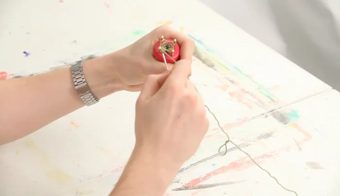 Cut the yarn, thread it through the last stitch.