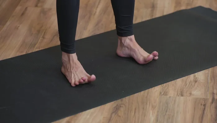 Once you find your center, lift your toes and spread them wide. This increases skin-to-surface contact.
