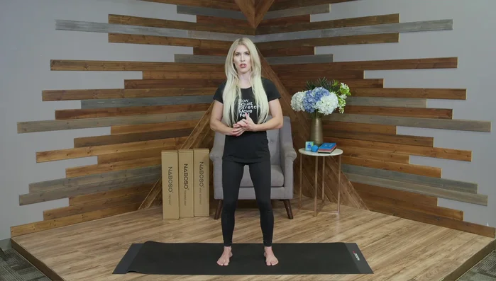 Softly bend your knees while maintaining centered weight distribution. This is the ideal posture for standing, squatting, and swinging a racquet or club.