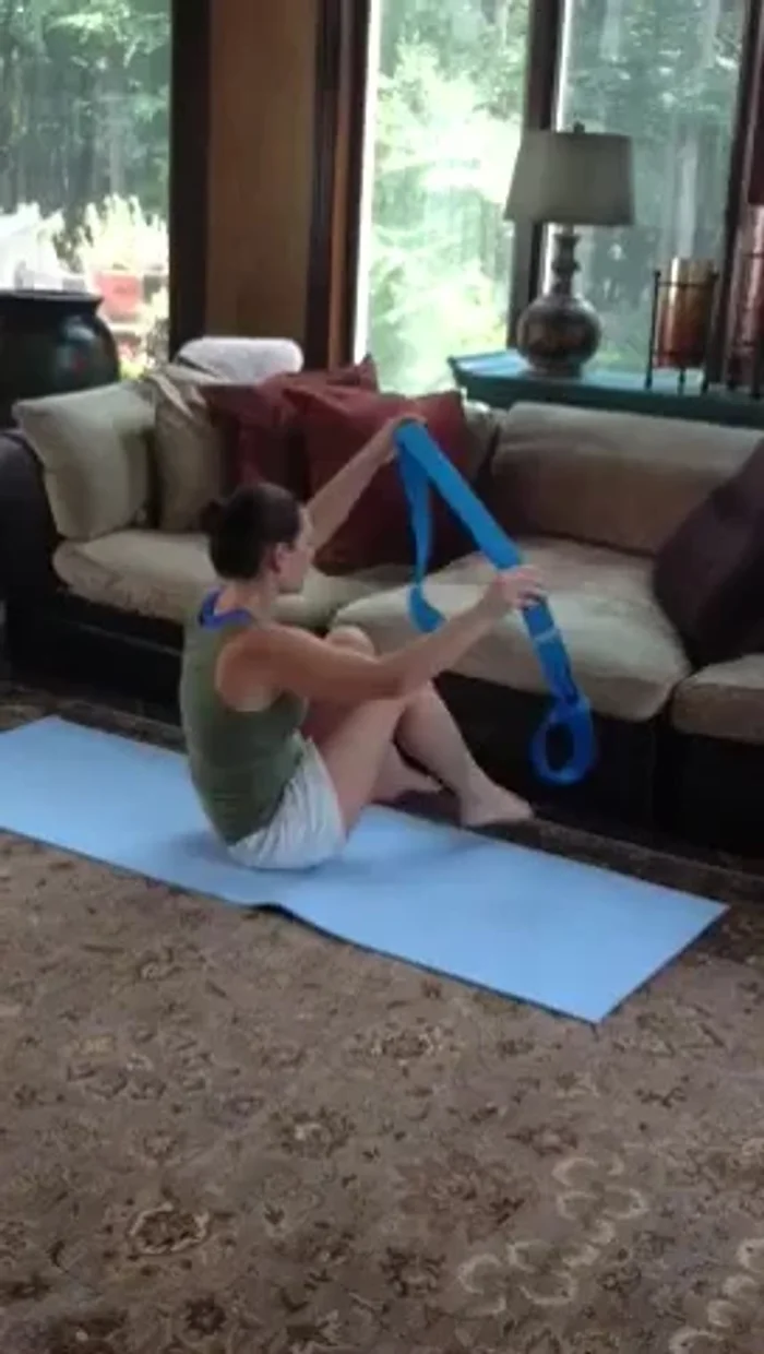 Cow Face Pose: Connect your hands using the loop.