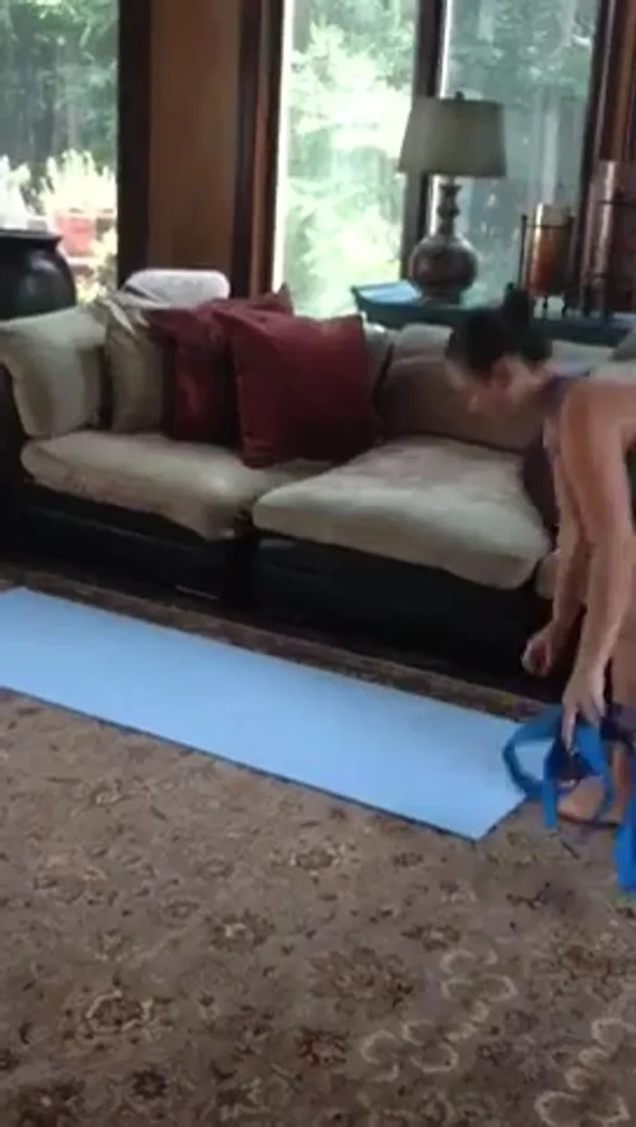 Rolling up your mat and attaching the My Yoga Loop for carrying.