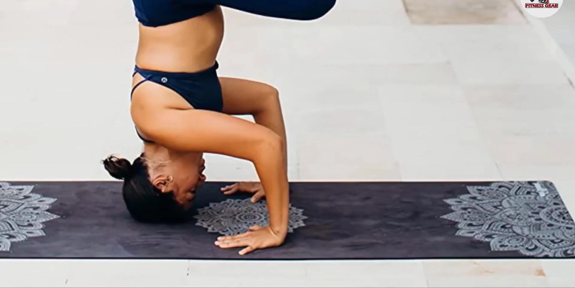 Image showing the carrying strap included with the Yoga Design Lab mat.