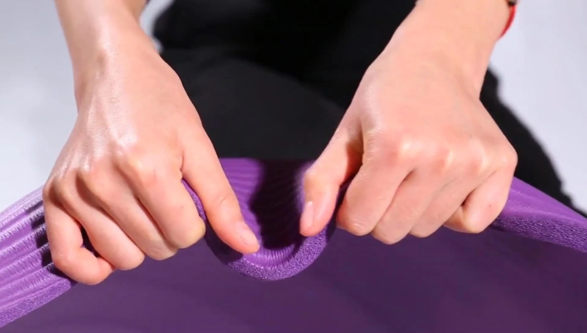 Person using the BalanceFrom mat for a yoga pose