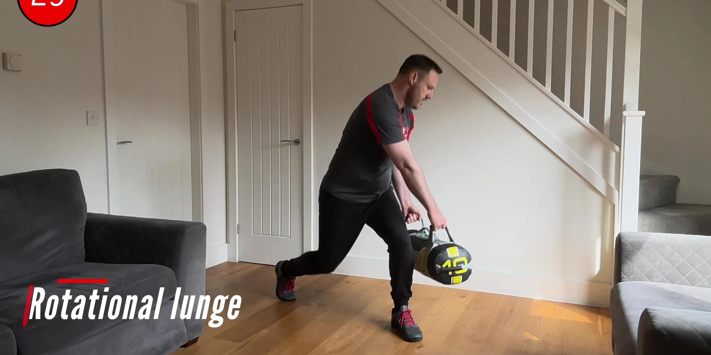 Instructor demonstrating the rotational lunge movement.