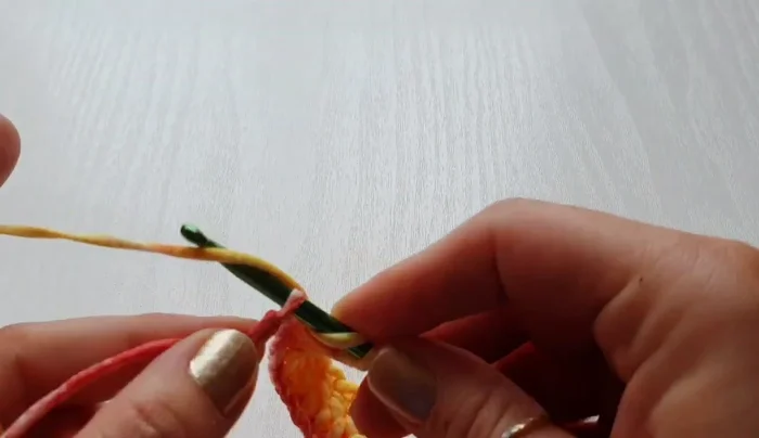 Turn your work and double crochet in the same space as the previous stitches, creating a neat row.