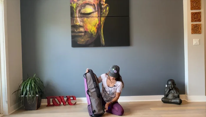 Highlights the cross-body carrying style.