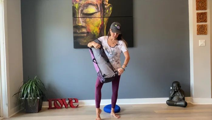 Highlights the cross-body carrying style.