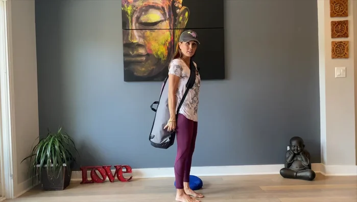 Highlights the cross-body carrying style.