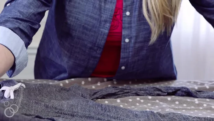 Place the wet item on a clean, dry towel and roll it up to remove more water.